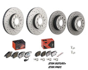 Set of brake rotors and pads with packaging on a white background