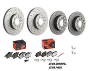 Set of brake rotors and pads with packaging on a white background