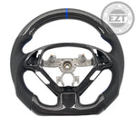 Load image into Gallery viewer, Carbon fiber steering wheel with metal center on a white background
