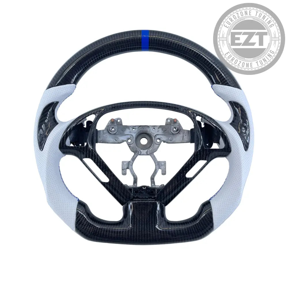 Carbon fiber steering wheel with white accents on a light blue background
